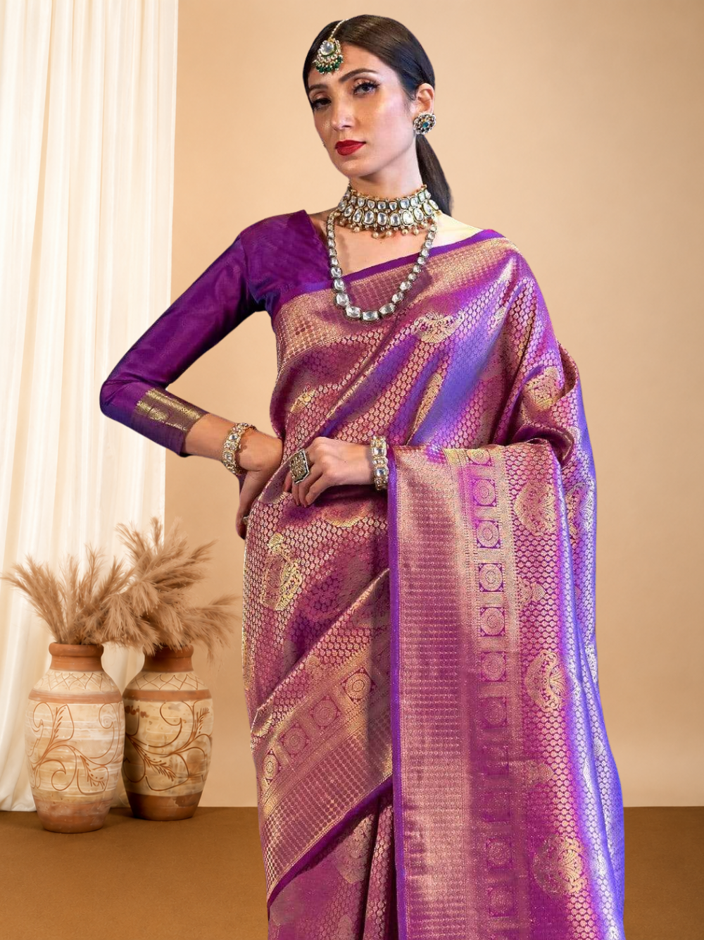 Purple color kanchipuram silk saree with zari weaving work.