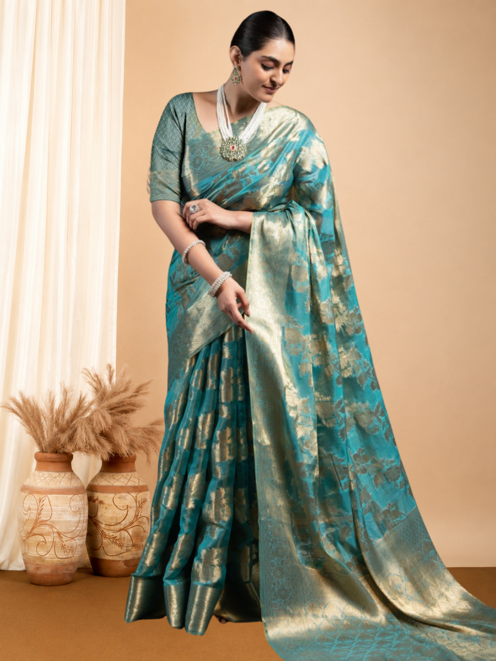 Rama green jimmy choo saree with weaving work.