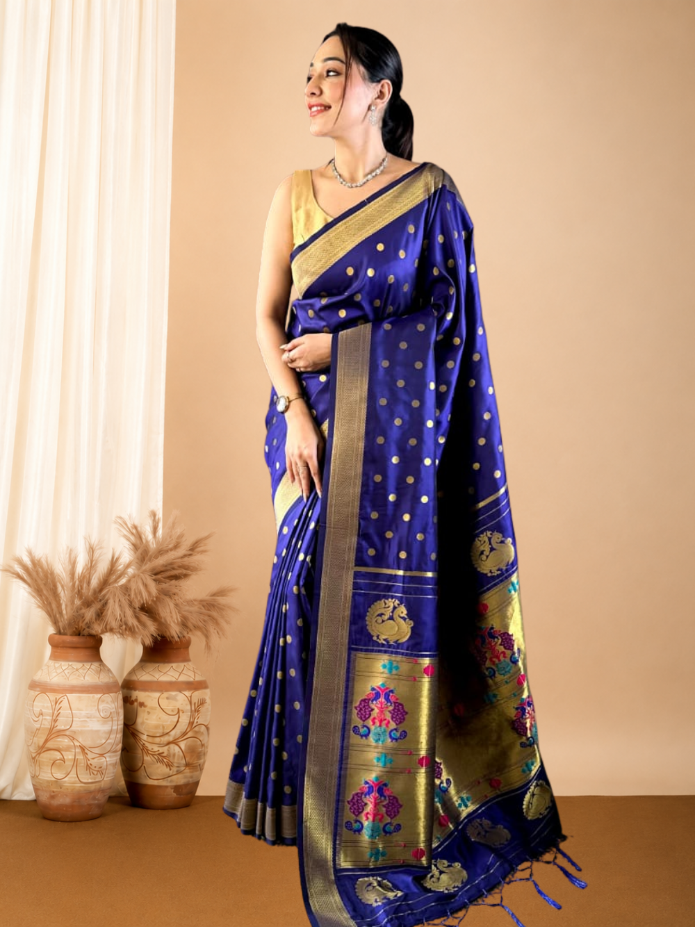 Traditional paithani silk saree with zari weaving work.