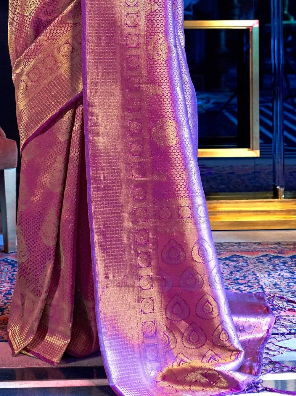 Purple color kanchipuram silk saree with zari weaving work.