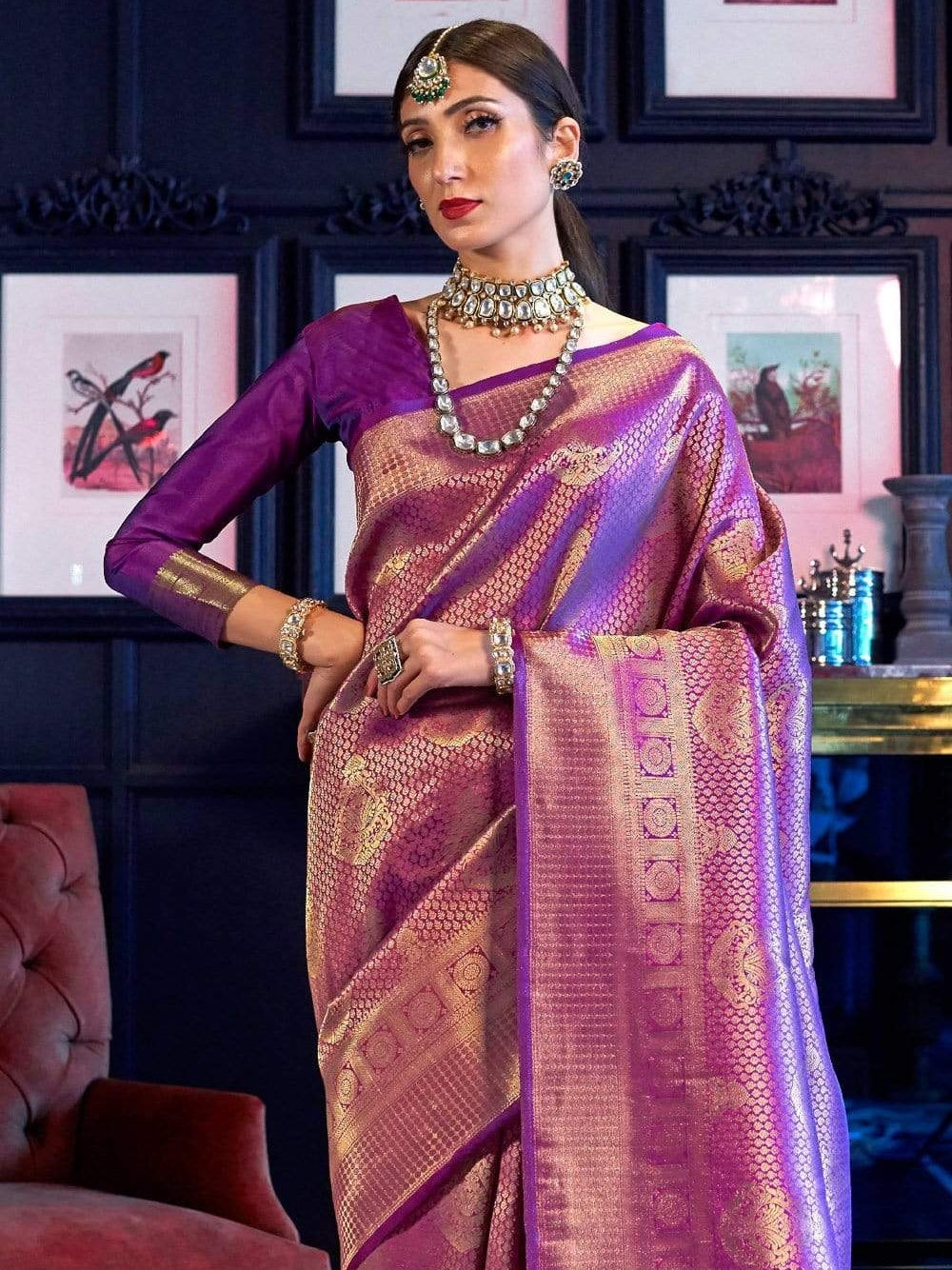 Purple color kanchipuram silk saree with zari weaving work.