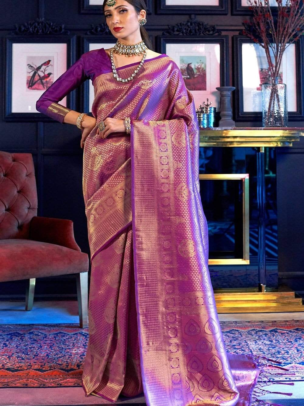 Purple color kanchipuram silk saree with zari weaving work.