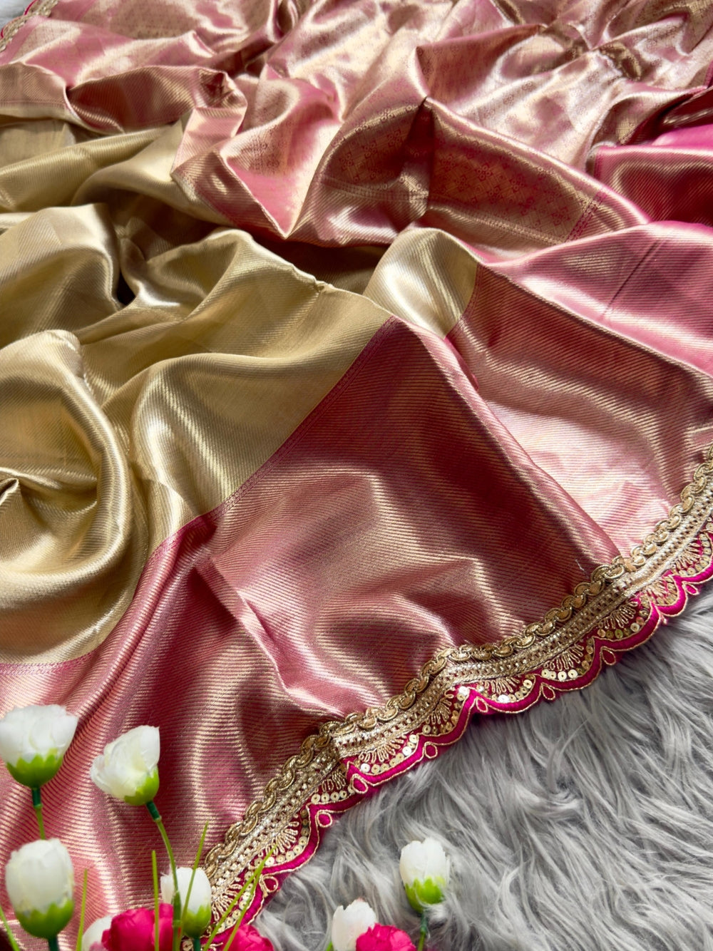 Gold soft tissue silk saree with chex design rich pallu and brocade blouse.