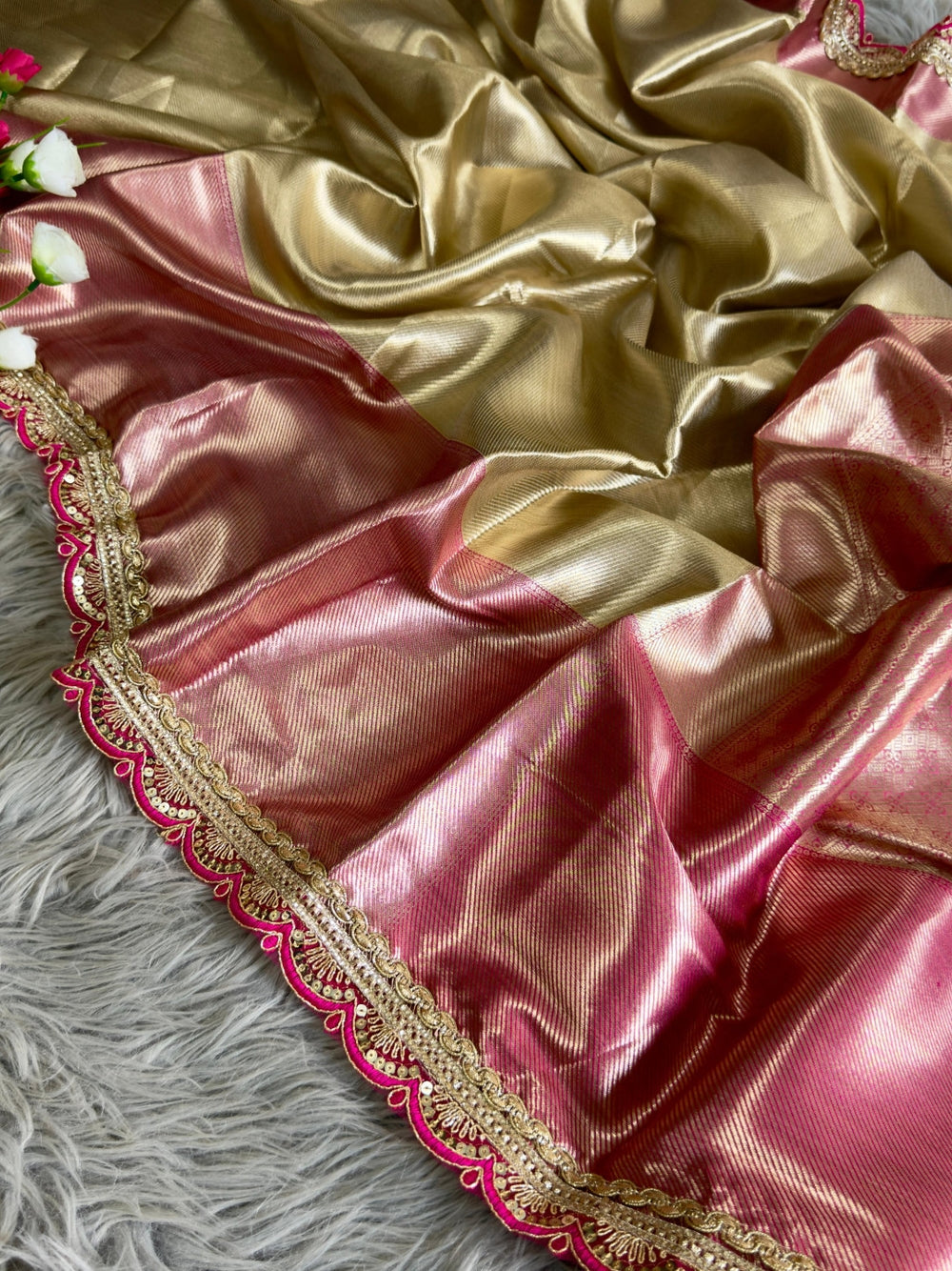 Gold soft tissue silk saree with chex design rich pallu and brocade blouse.