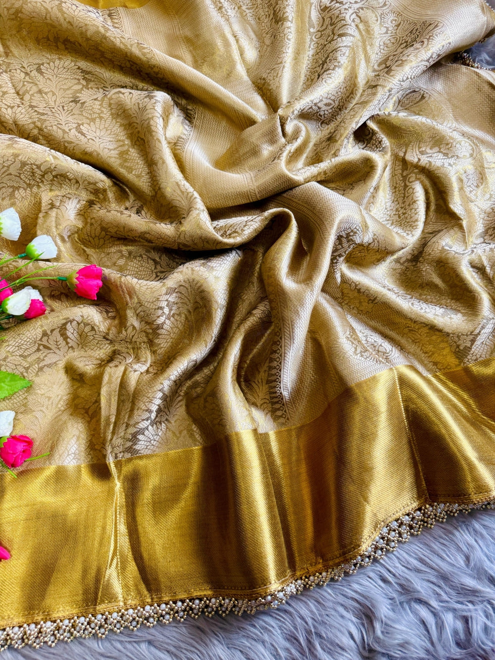 Gold premium banarasi tissue silk saree with zari weaving work.