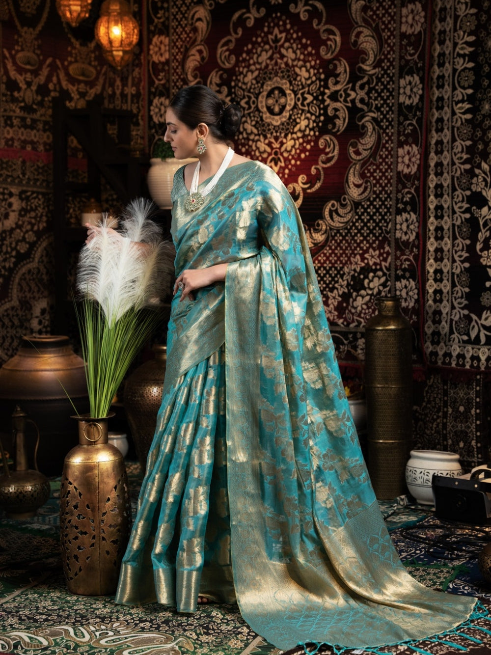 Rama green jimmy choo saree with weaving work.