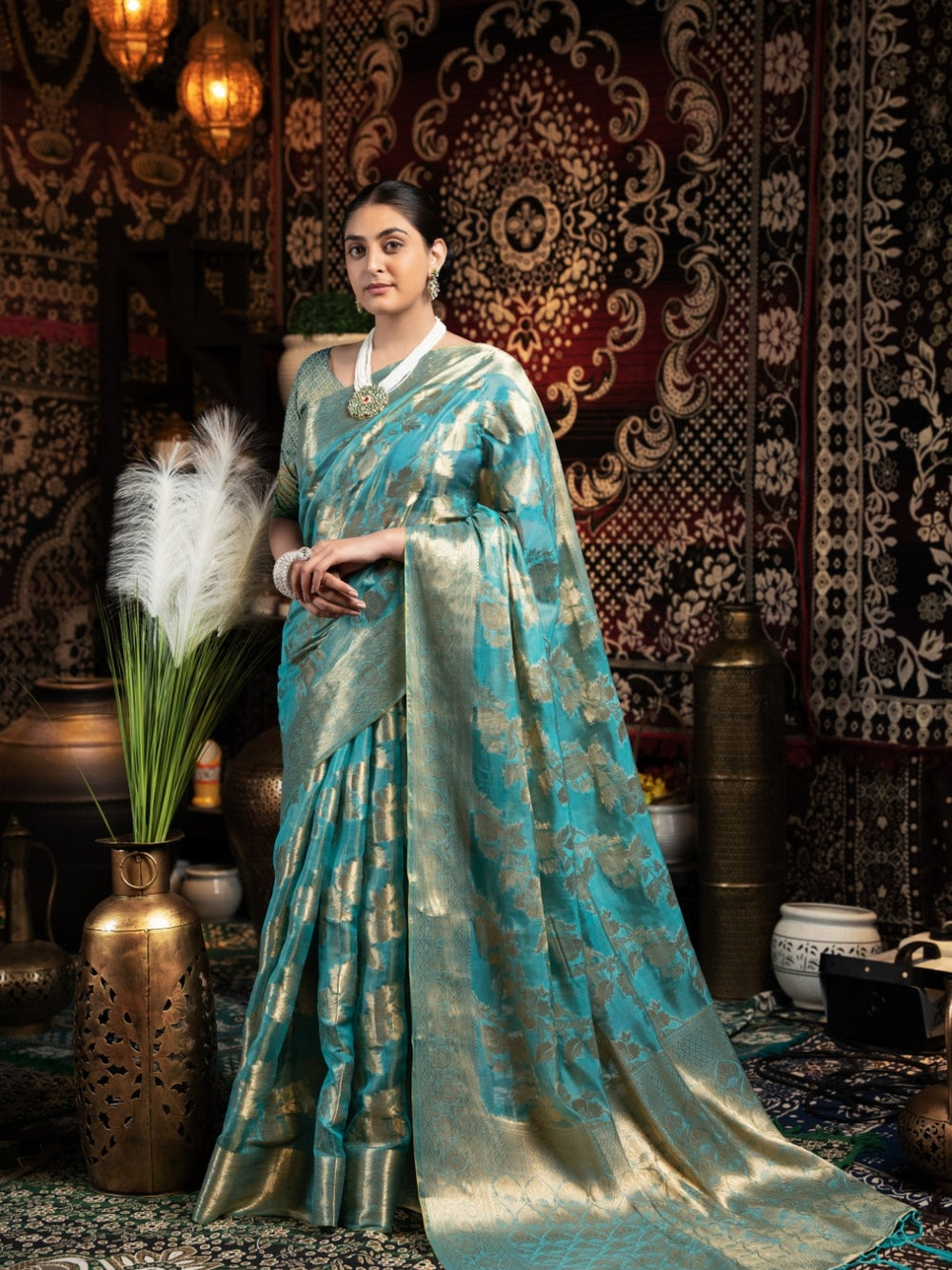 Rama green jimmy choo saree with weaving work.