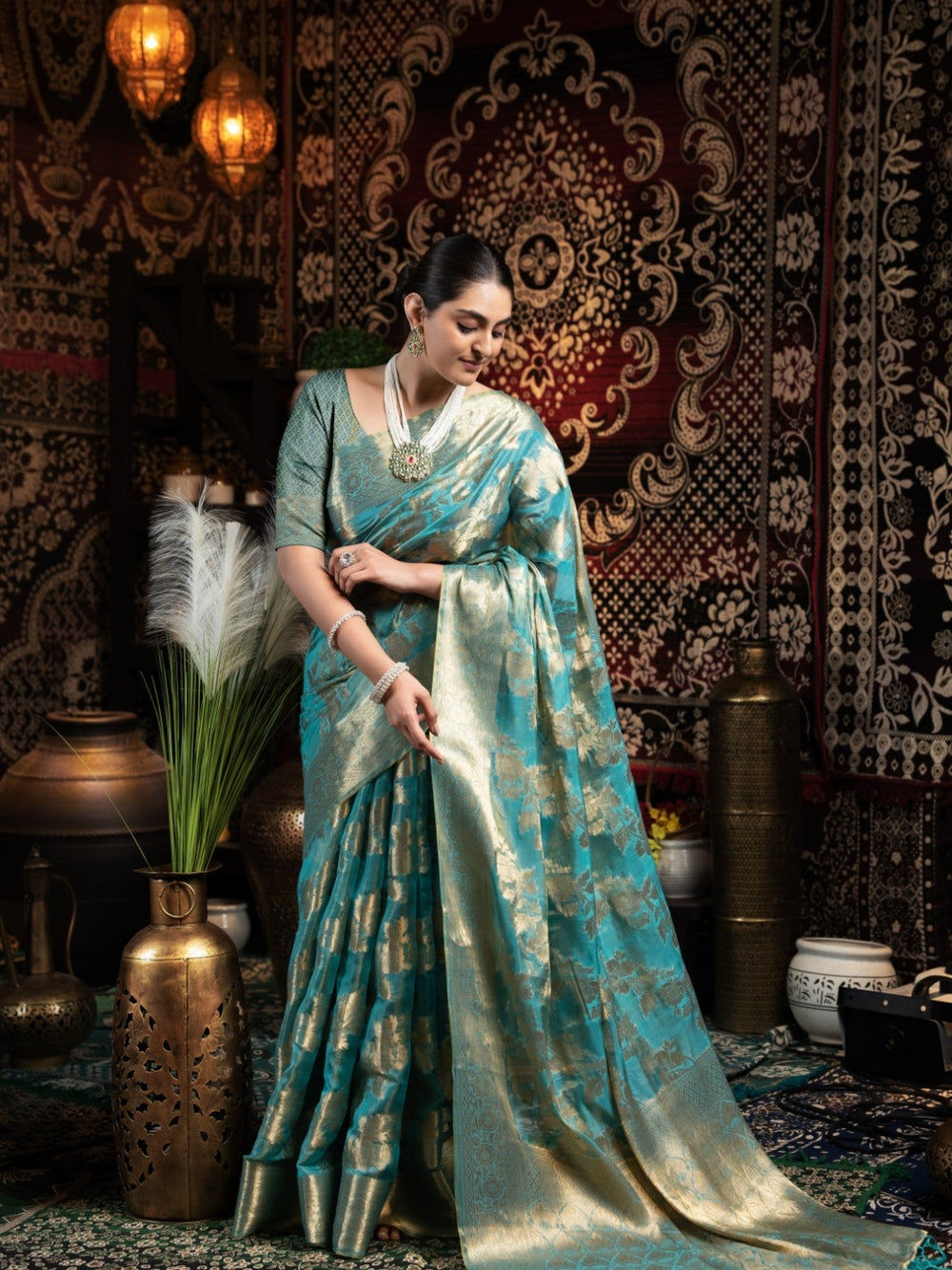 Rama green jimmy choo saree with weaving work.