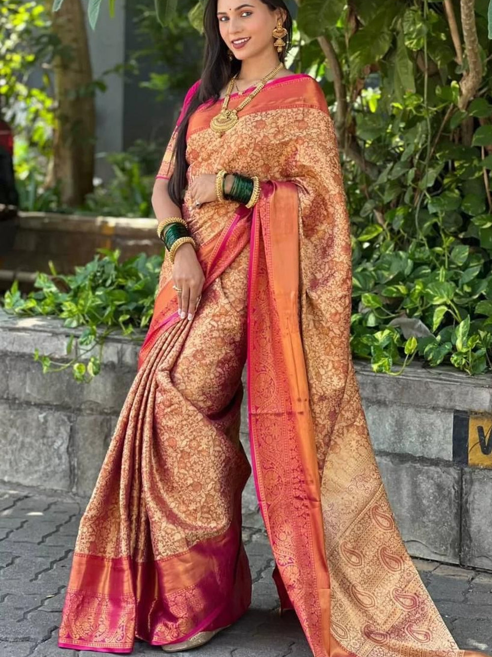 Premium banarasi tissue silk saree with zari weaving work.
