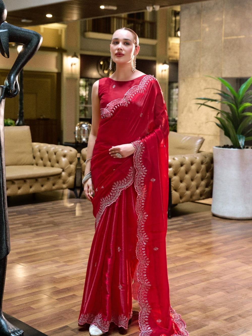 Fancy jimmy choo party wear saree with embroidery work.