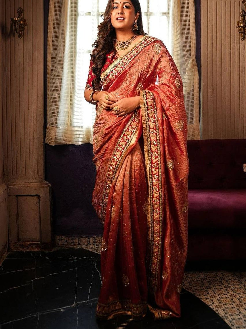 Red crush banarasi silk saree with embroidery work lace border.
