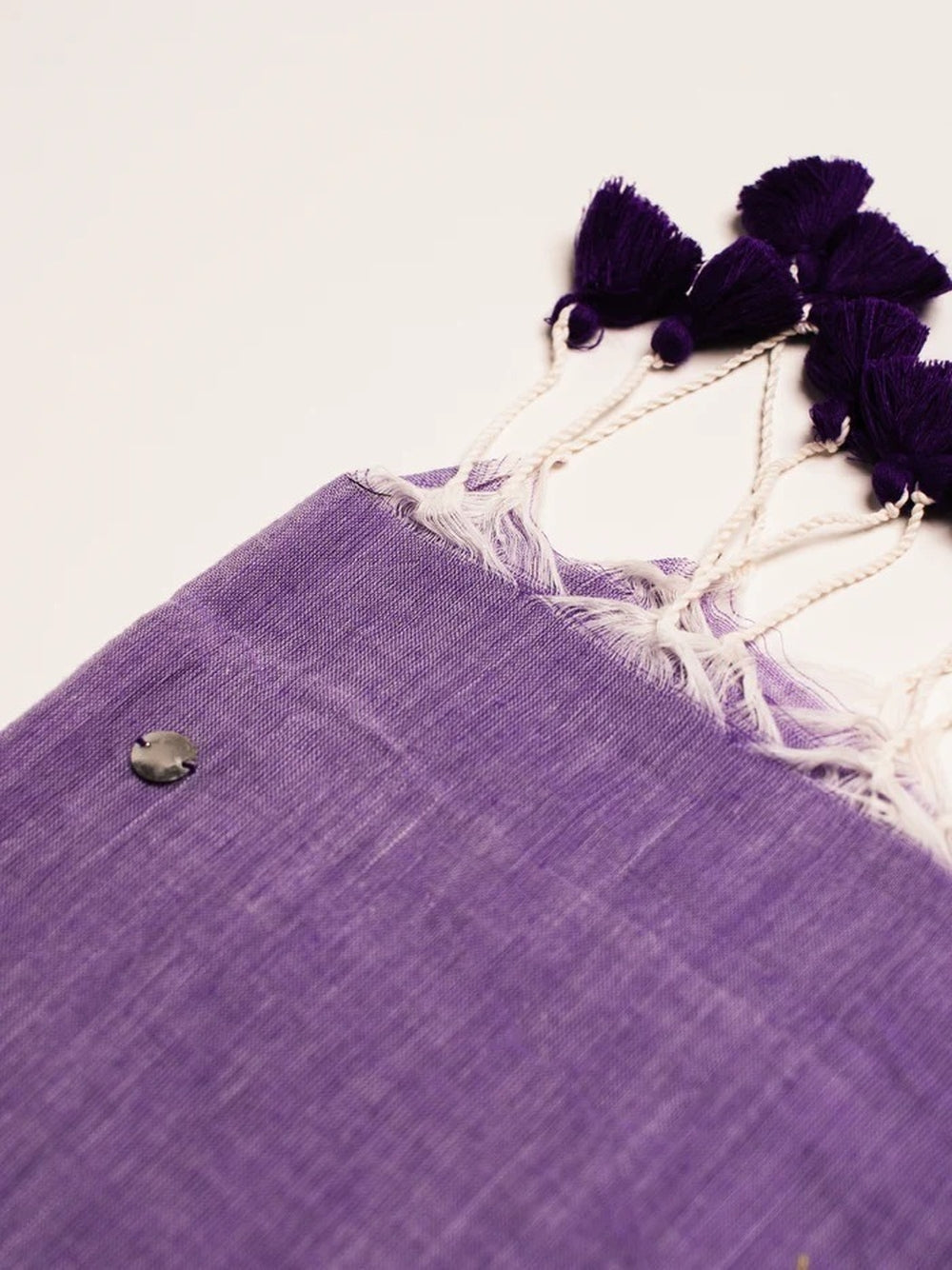 Plain khadi cotton saree with ginni and fancy tassel work.