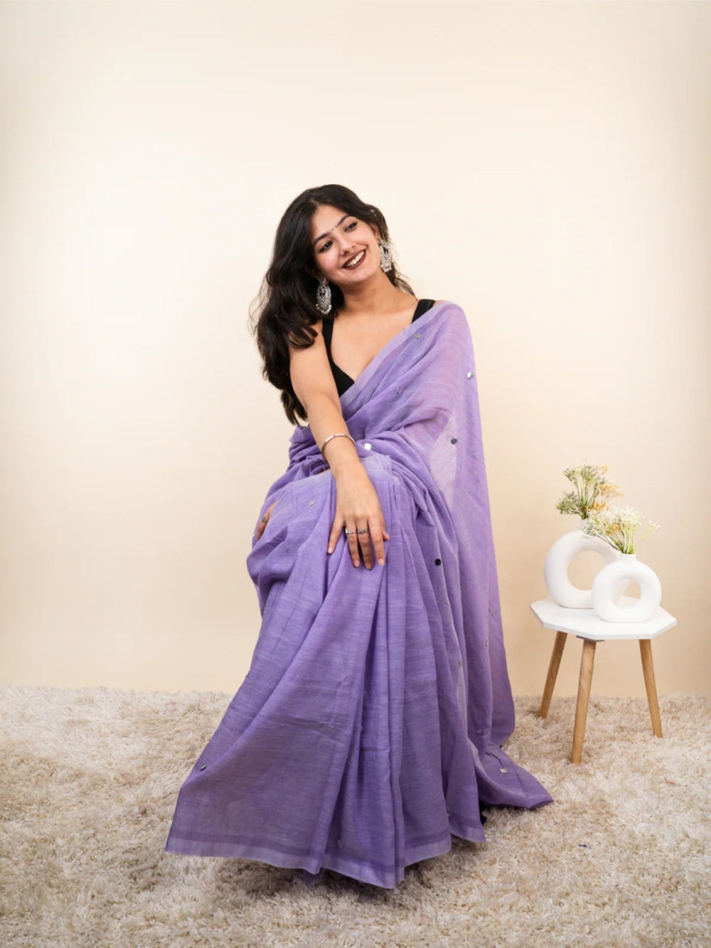 Plain khadi cotton saree with ginni and fancy tassel work.