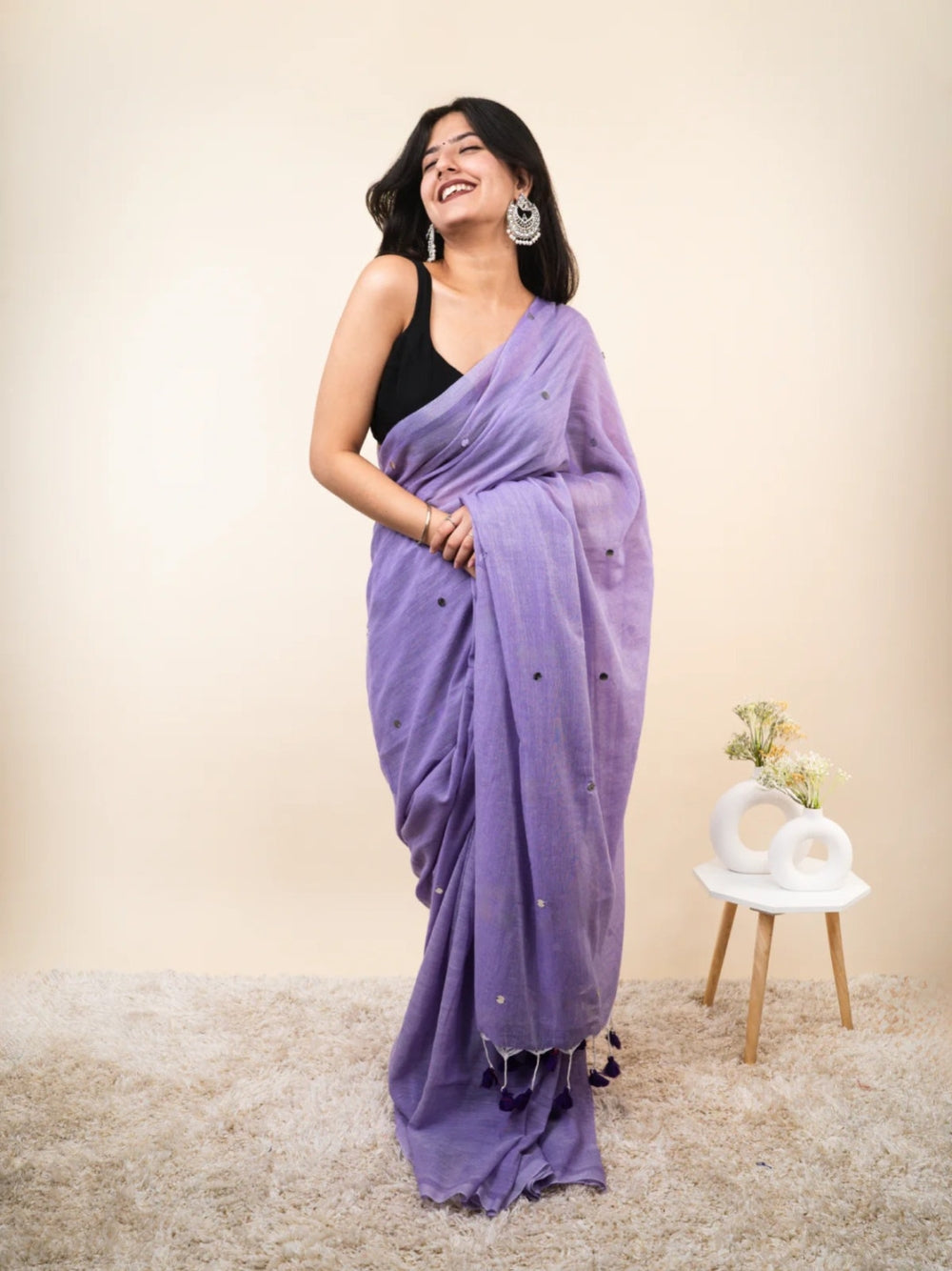 Plain khadi cotton saree with ginni and fancy tassel work.