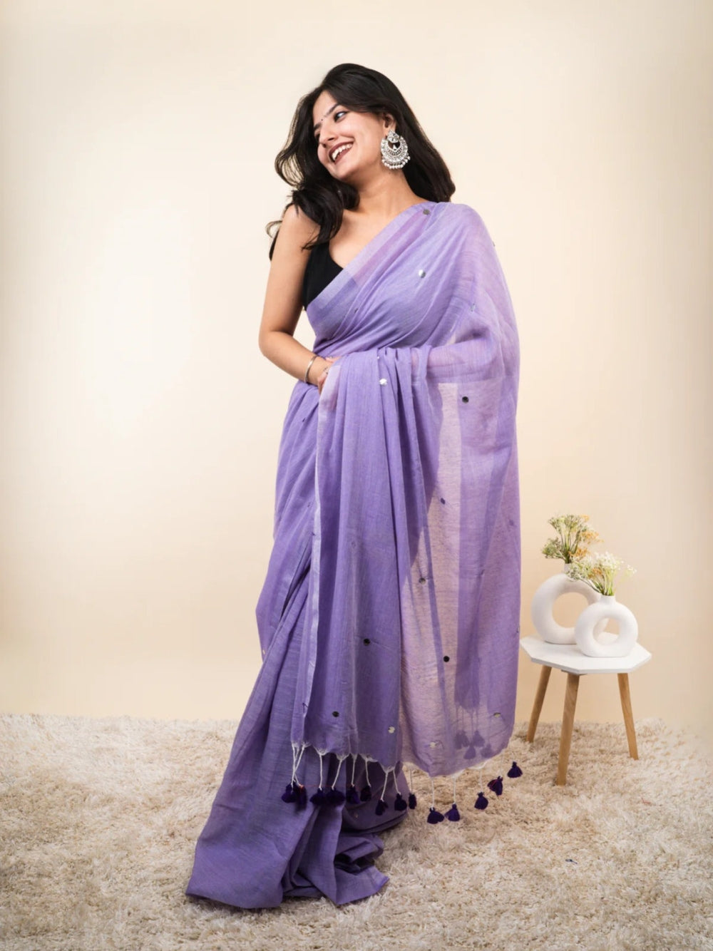 Plain khadi cotton saree with ginni and fancy tassel work.