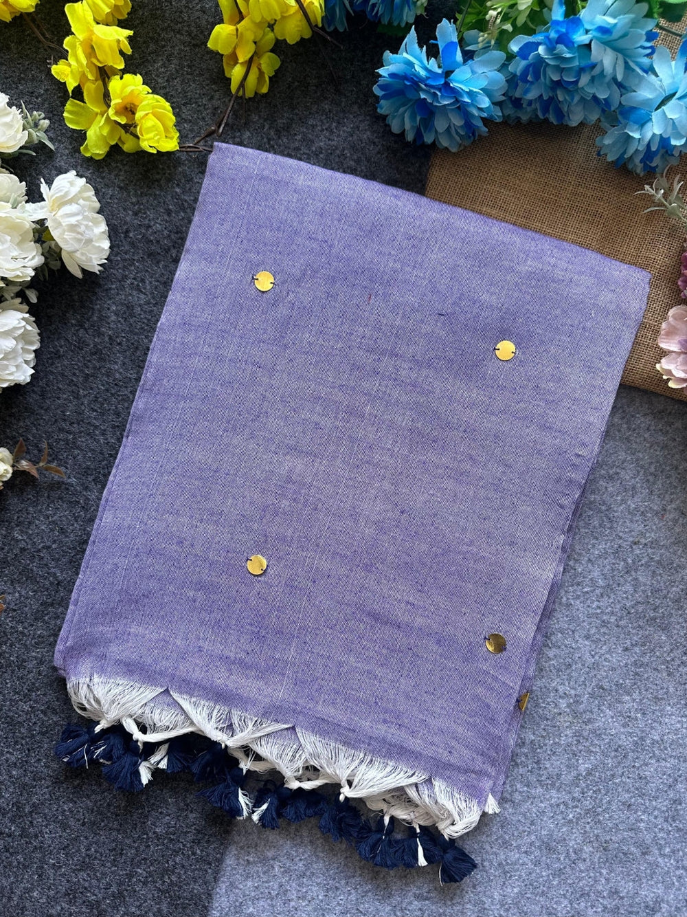 Plain khadi cotton saree with ginni and fancy tassel work.