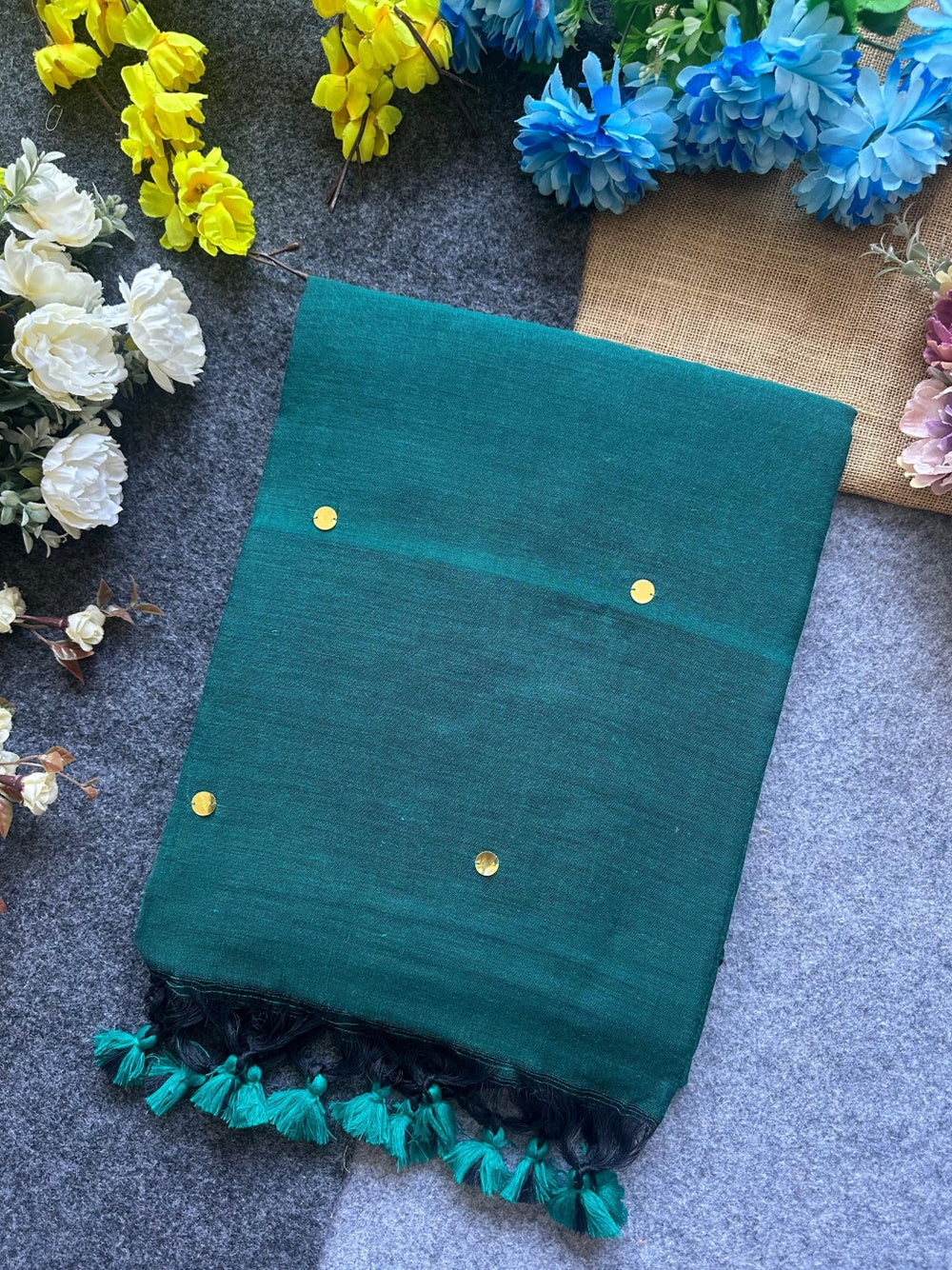 Plain khadi cotton saree with ginni and fancy tassel work.