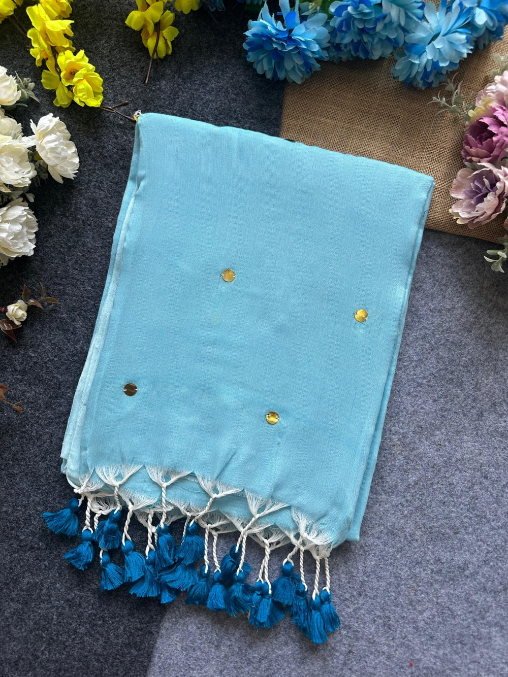 Plain khadi cotton saree with ginni and fancy tassel work.