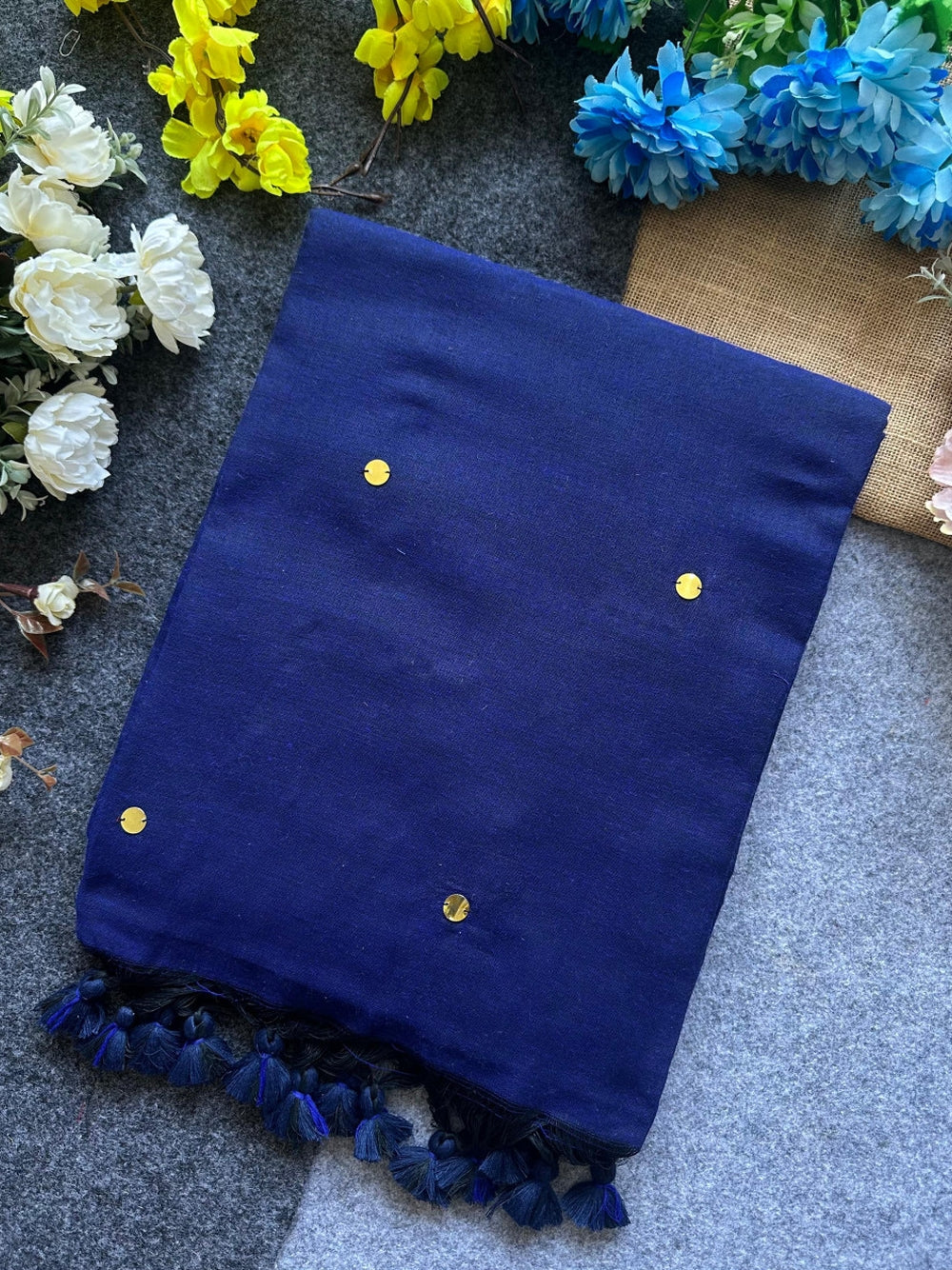 Plain khadi cotton saree with ginni and fancy tassel work.