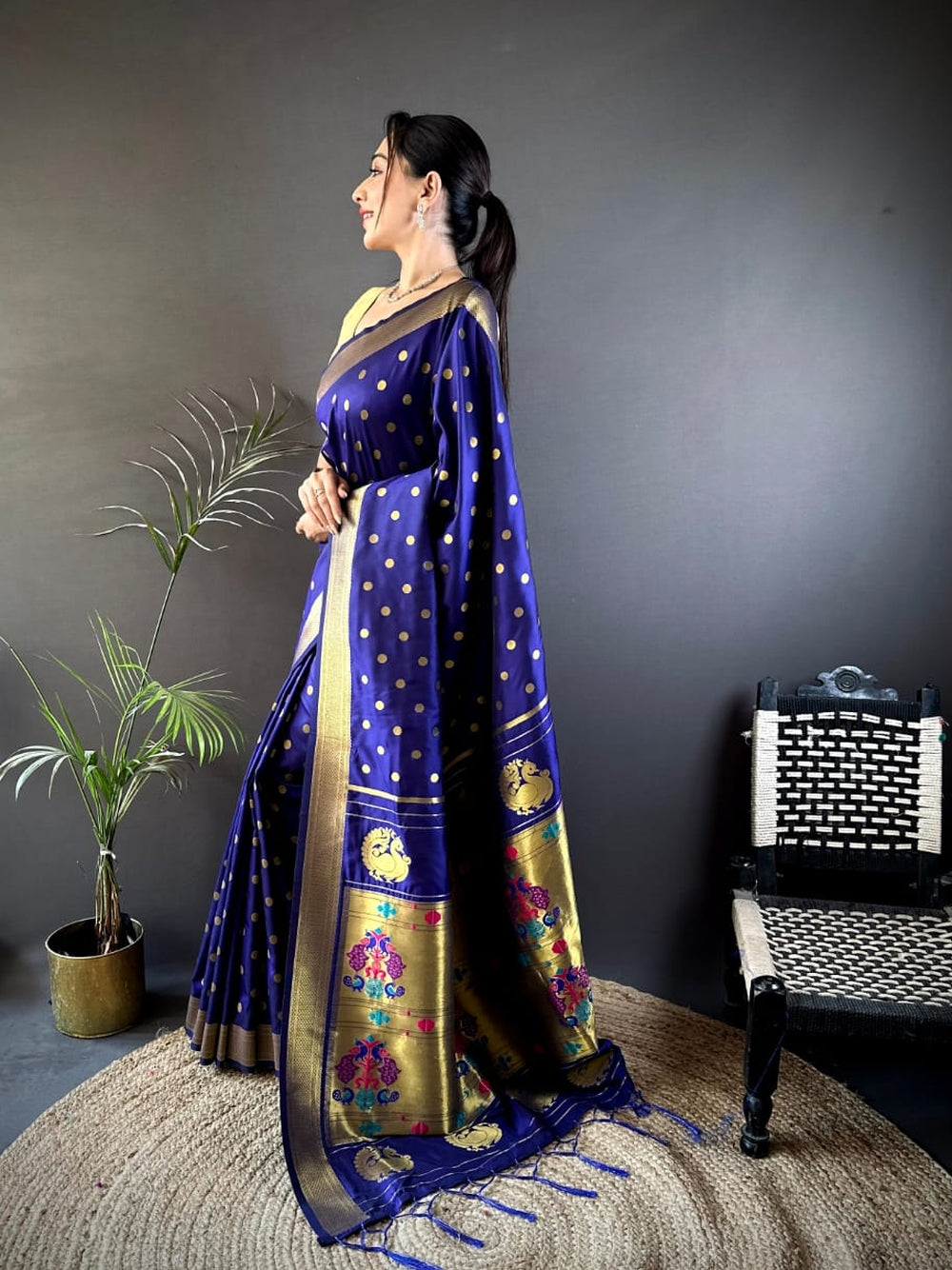 Traditional paithani silk saree with zari weaving work.