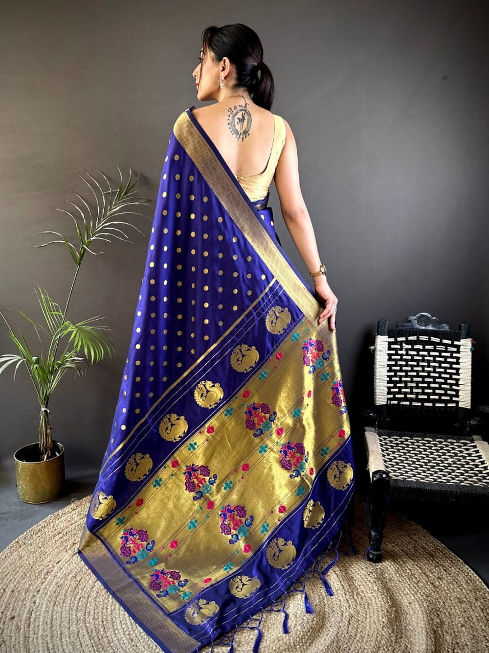 Traditional paithani silk saree with zari weaving work.