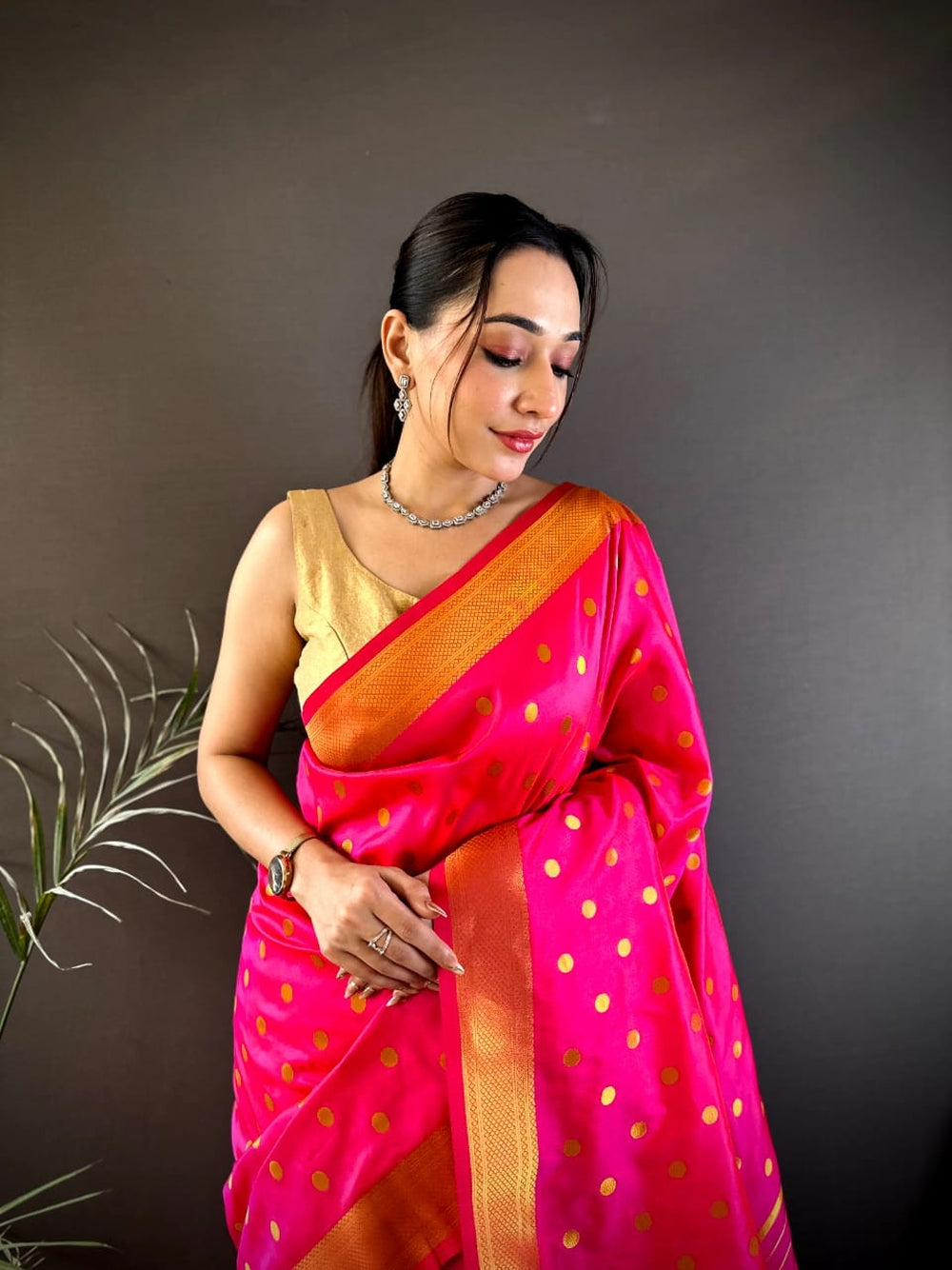 Traditional paithani silk saree with zari weaving work.