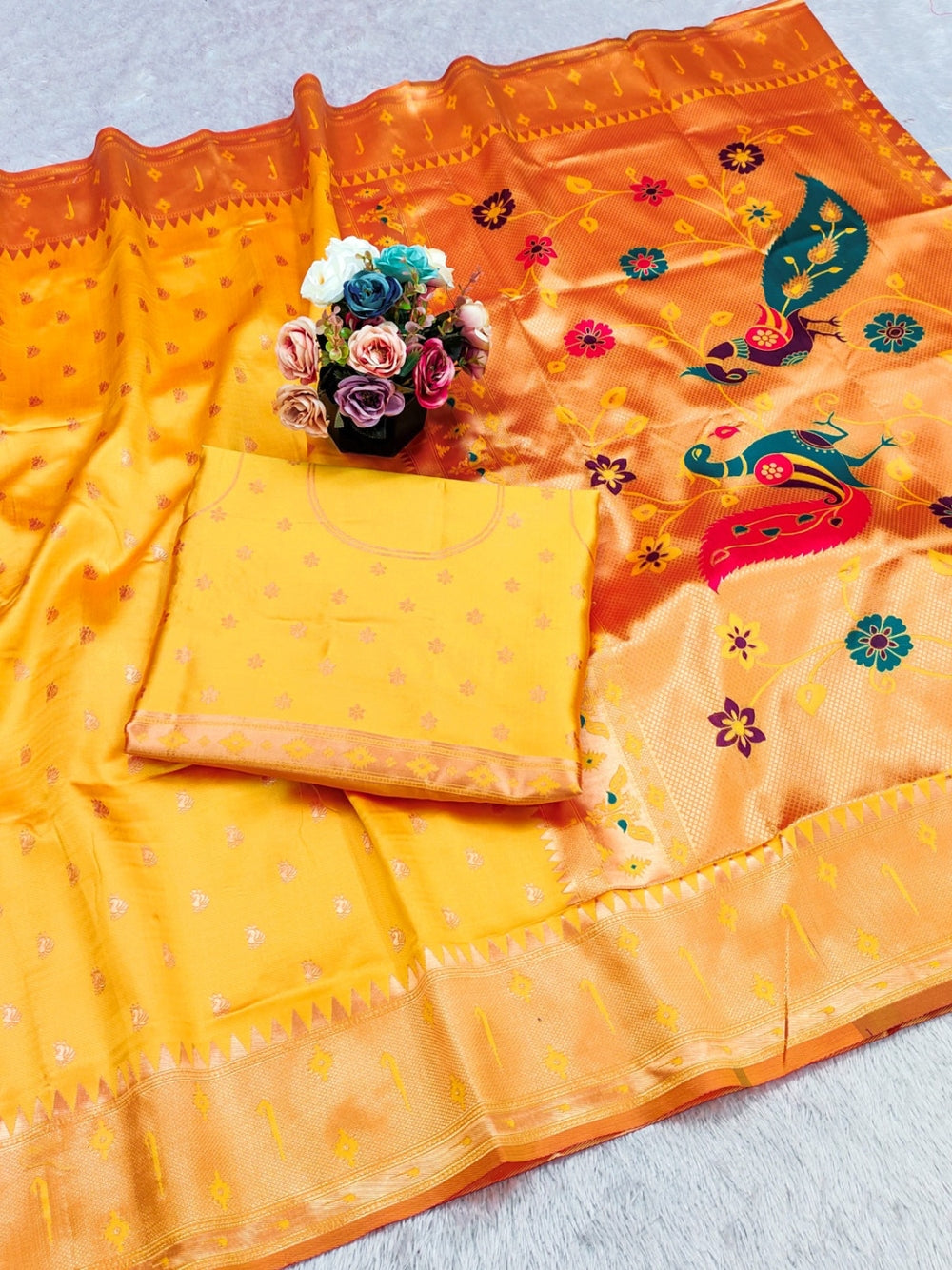 Traditional  paithani silk saree with zari weaving work.