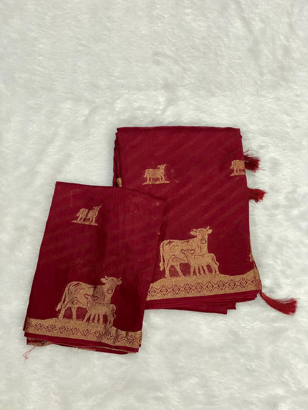 Maroon viscose dola silk saree with slef zari weaving work.