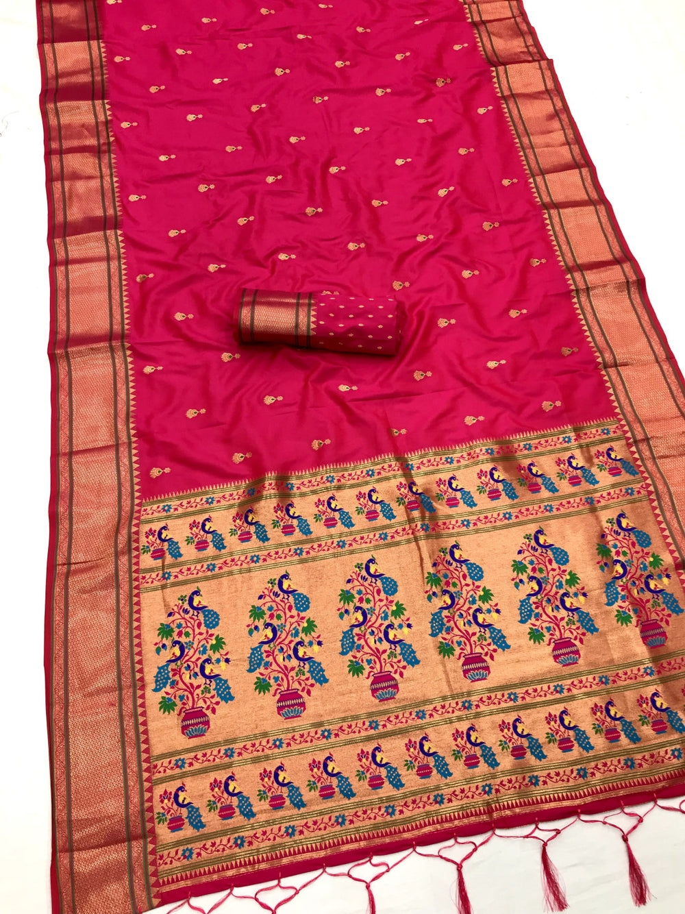Lichi silk paithani saree with zari weaving work.
