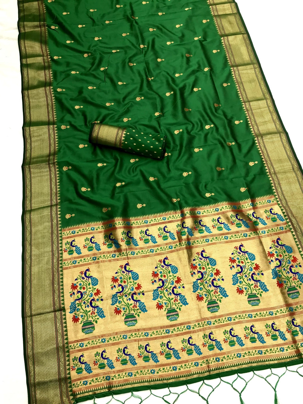 Lichi silk paithani saree with zari weaving work.