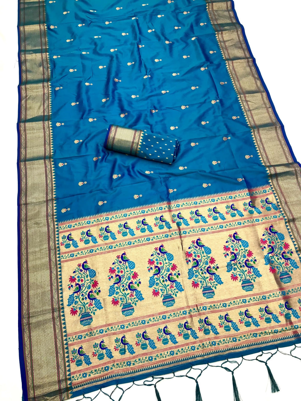 Lichi silk paithani saree with zari weaving work.
