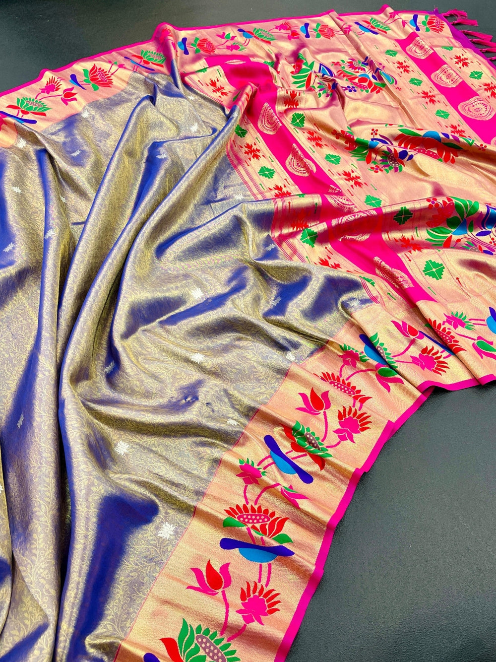 Soft tissue paithani silk saree with zari weaving work.