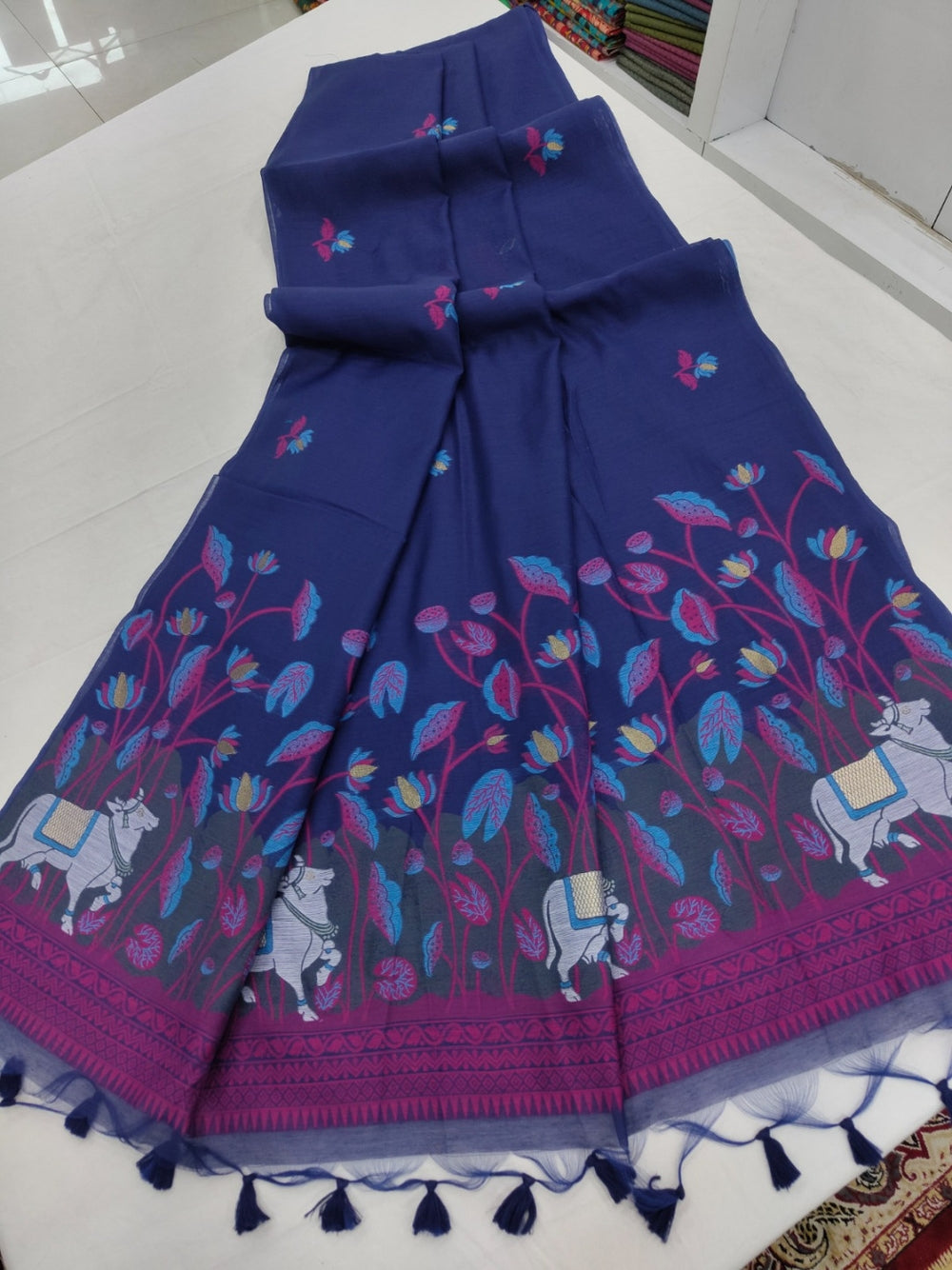 Navy blue premium muga cotton saree with pichwai & floral weaving work.